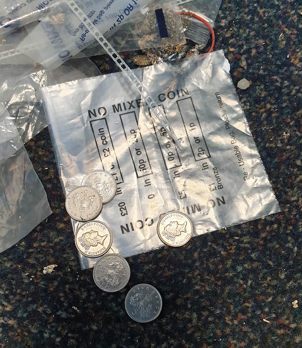 30p in five pences and plastic money bags